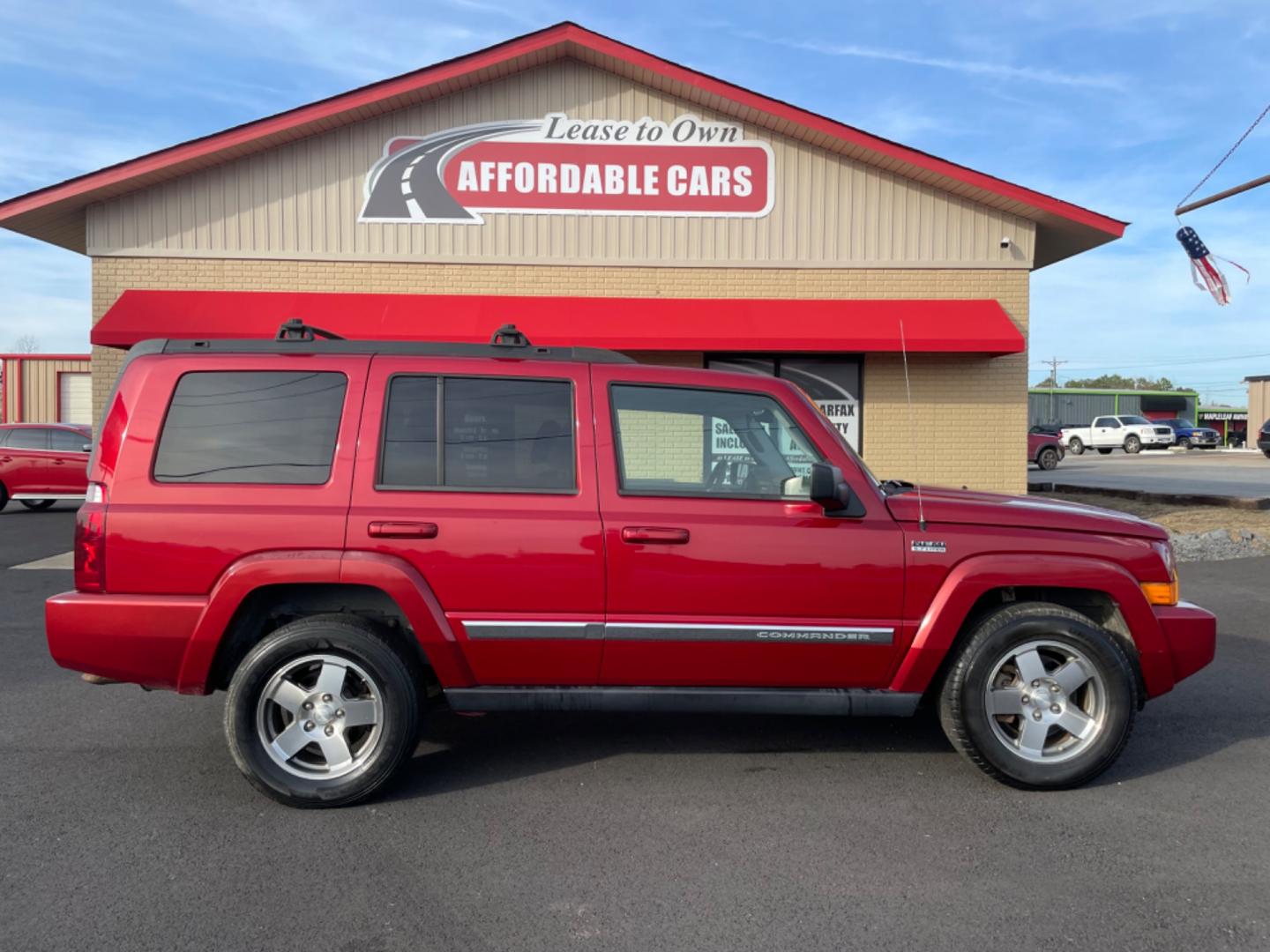 2010 Maroon Jeep Commander (1J4RH4GT5AC) with an V6, 3.7 Liter engine, Automatic, 5-Spd w/Overdrive transmission, located at 8008 Warden Rd, Sherwood, AR, 72120, (501) 801-6100, 34.830078, -92.186684 - Photo#0