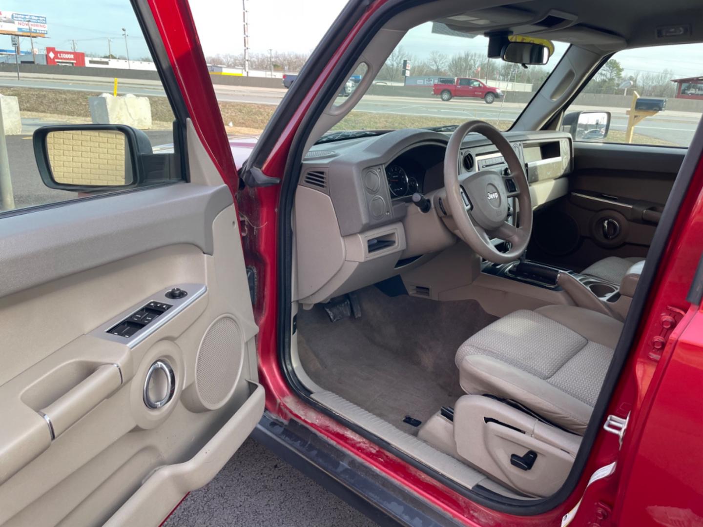 2010 Maroon Jeep Commander (1J4RH4GT5AC) with an V6, 3.7 Liter engine, Automatic, 5-Spd w/Overdrive transmission, located at 8008 Warden Rd, Sherwood, AR, 72120, (501) 801-6100, 34.830078, -92.186684 - Photo#12