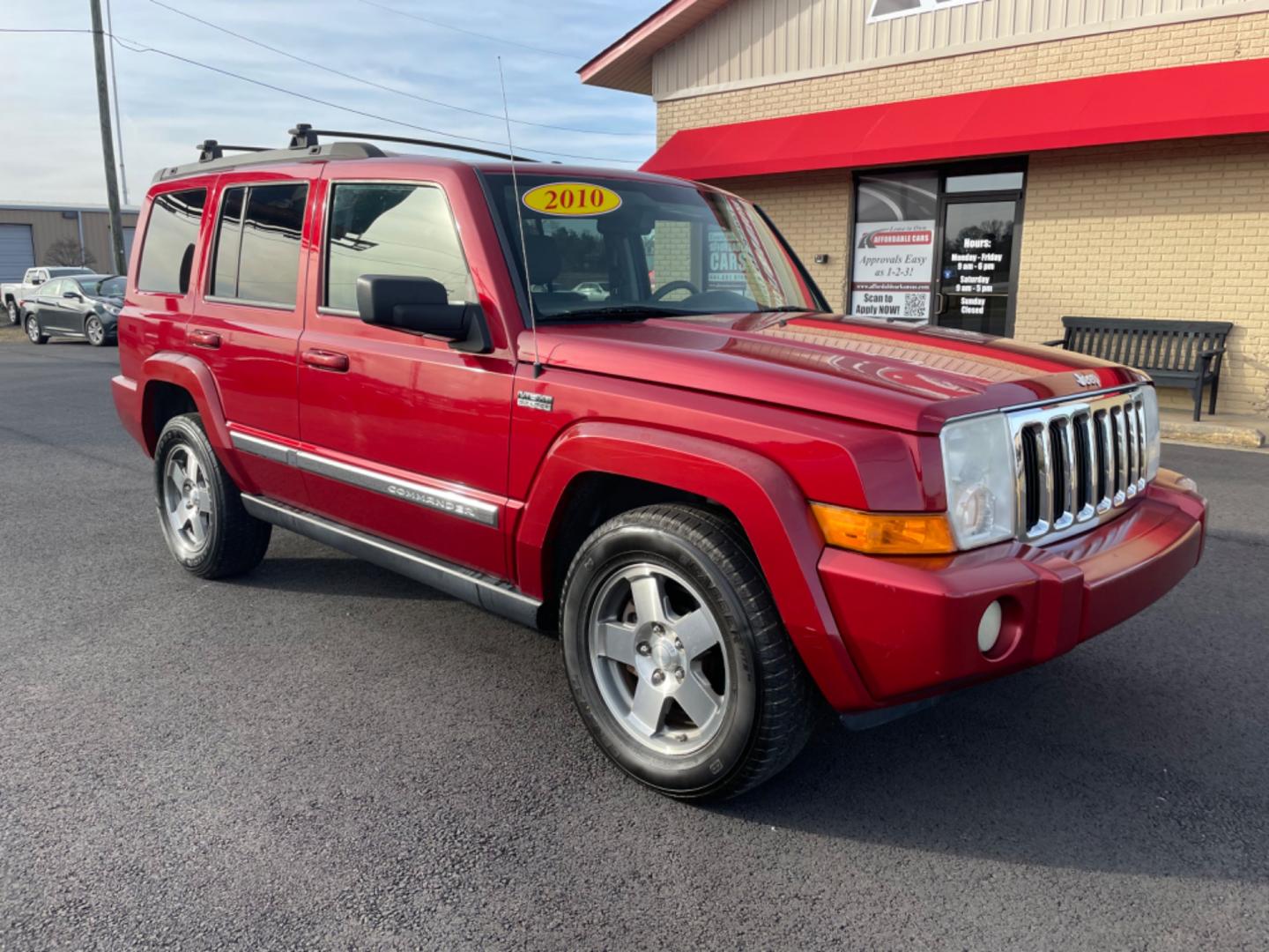 2010 Maroon Jeep Commander (1J4RH4GT5AC) with an V6, 3.7 Liter engine, Automatic, 5-Spd w/Overdrive transmission, located at 8008 Warden Rd, Sherwood, AR, 72120, (501) 801-6100, 34.830078, -92.186684 - Photo#1