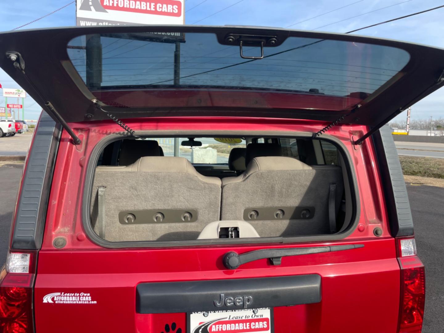 2010 Maroon Jeep Commander (1J4RH4GT5AC) with an V6, 3.7 Liter engine, Automatic, 5-Spd w/Overdrive transmission, located at 8008 Warden Rd, Sherwood, AR, 72120, (501) 801-6100, 34.830078, -92.186684 - Photo#8