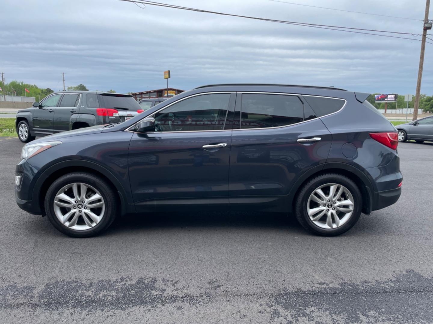 2014 Blue Hyundai Santa Fe Sport (5XYZU3LA0EG) with an 4-Cyl, Turbo, GDI, 2.0L engine, Auto, 6-Spd Shftrnc transmission, located at 8008 Warden Rd, Sherwood, AR, 72120, (501) 801-6100, 34.830078, -92.186684 - Photo#4