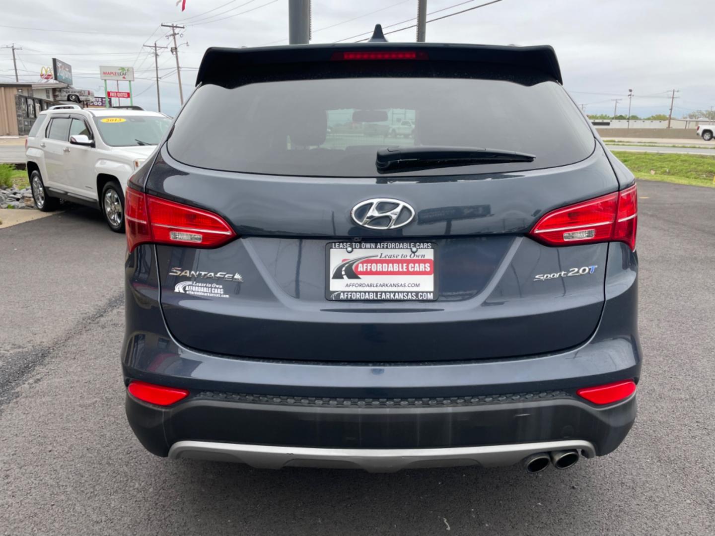 2014 Blue Hyundai Santa Fe Sport (5XYZU3LA0EG) with an 4-Cyl, Turbo, GDI, 2.0L engine, Auto, 6-Spd Shftrnc transmission, located at 8008 Warden Rd, Sherwood, AR, 72120, (501) 801-6100, 34.830078, -92.186684 - Photo#6