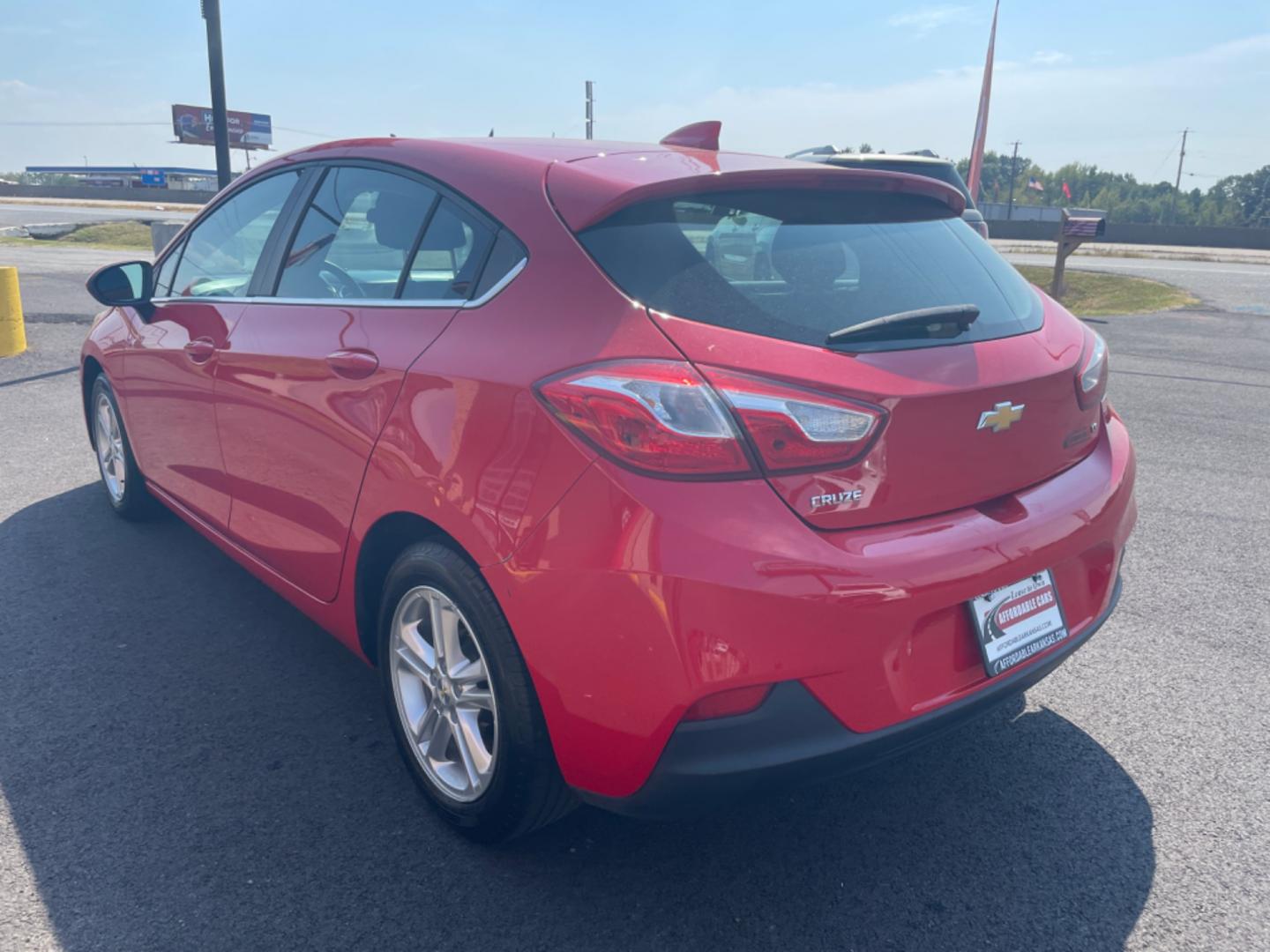 2017 Red Chevrolet Cruze (3G1BE6SM9HS) with an 4-Cyl, Turbo, 1.4 Liter engine, Automatic, 6-Spd transmission, located at 8008 Warden Rd, Sherwood, AR, 72120, (501) 801-6100, 34.830078, -92.186684 - Photo#5