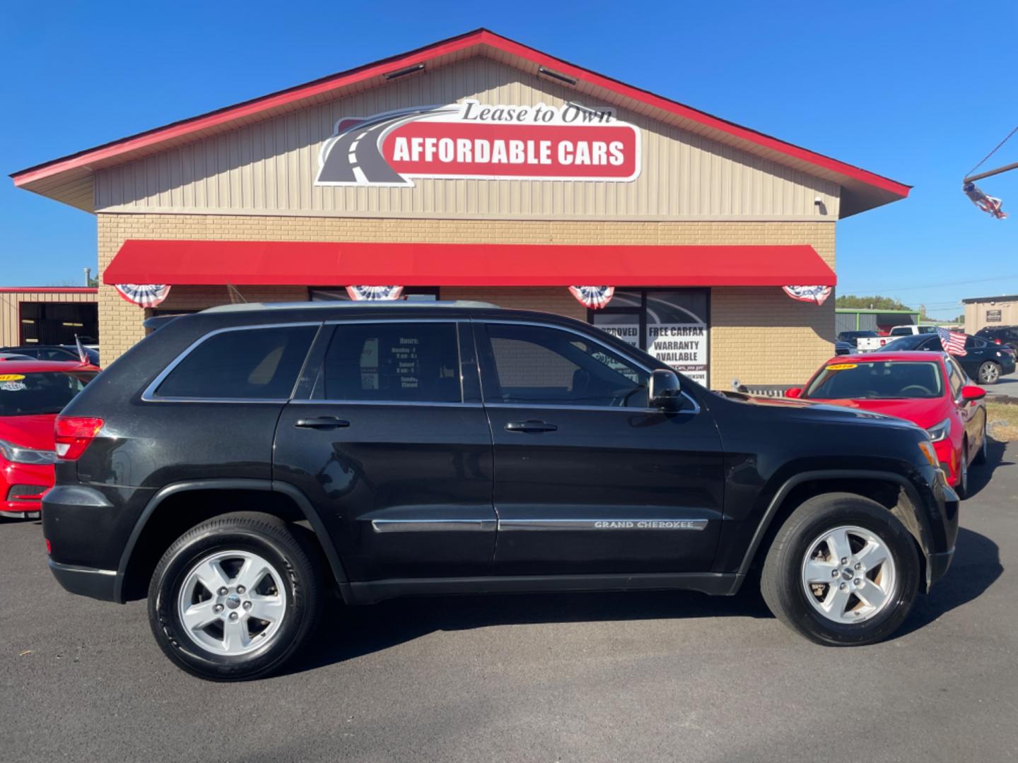 2012 Black Jeep Grand Cherokee (1C4RJFAG9CC) with an V6, Flex Fuel, 3.6 Liter engine, Automatic, 5-Spd transmission, located at 8008 Warden Rd, Sherwood, AR, 72120, (501) 801-6100, 34.830078, -92.186684 - Photo#0