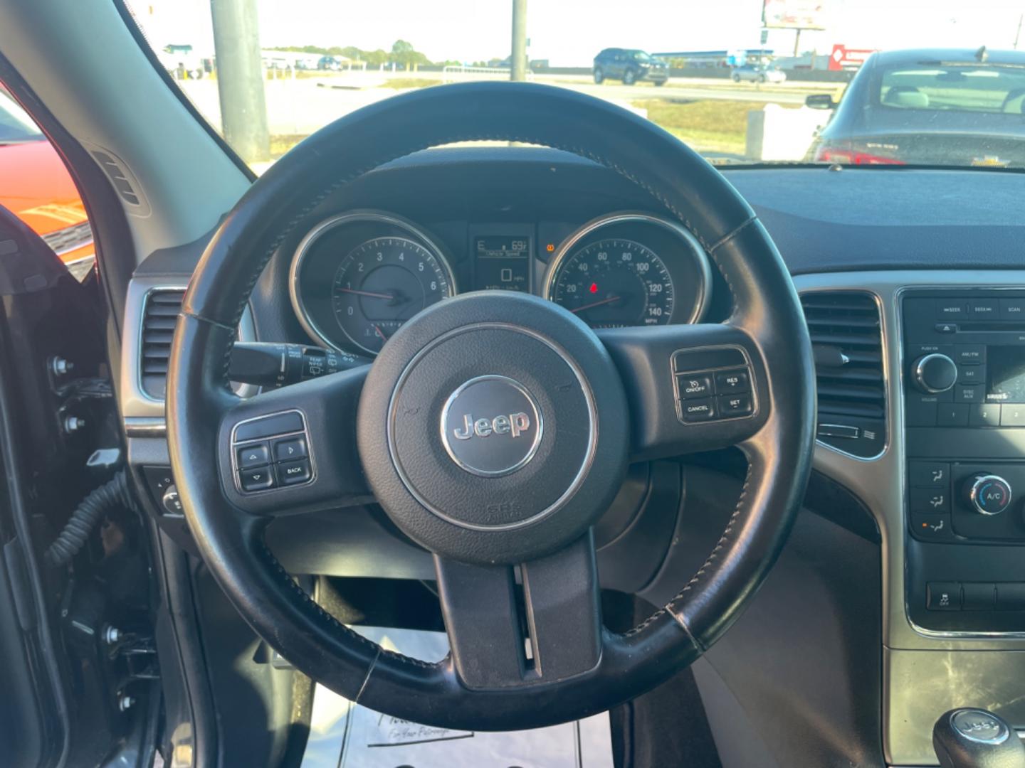 2012 Black Jeep Grand Cherokee (1C4RJFAG9CC) with an V6, Flex Fuel, 3.6 Liter engine, Automatic, 5-Spd transmission, located at 8008 Warden Rd, Sherwood, AR, 72120, (501) 801-6100, 34.830078, -92.186684 - Photo#16