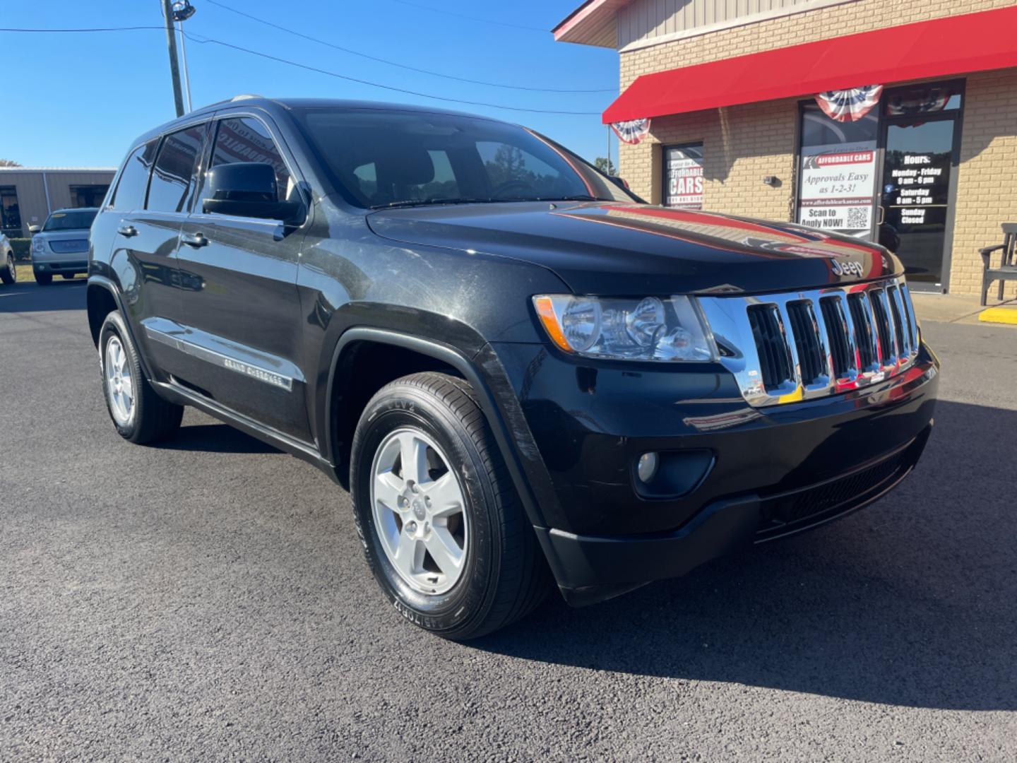 2012 Black Jeep Grand Cherokee (1C4RJFAG9CC) with an V6, Flex Fuel, 3.6 Liter engine, Automatic, 5-Spd transmission, located at 8008 Warden Rd, Sherwood, AR, 72120, (501) 801-6100, 34.830078, -92.186684 - Photo#1