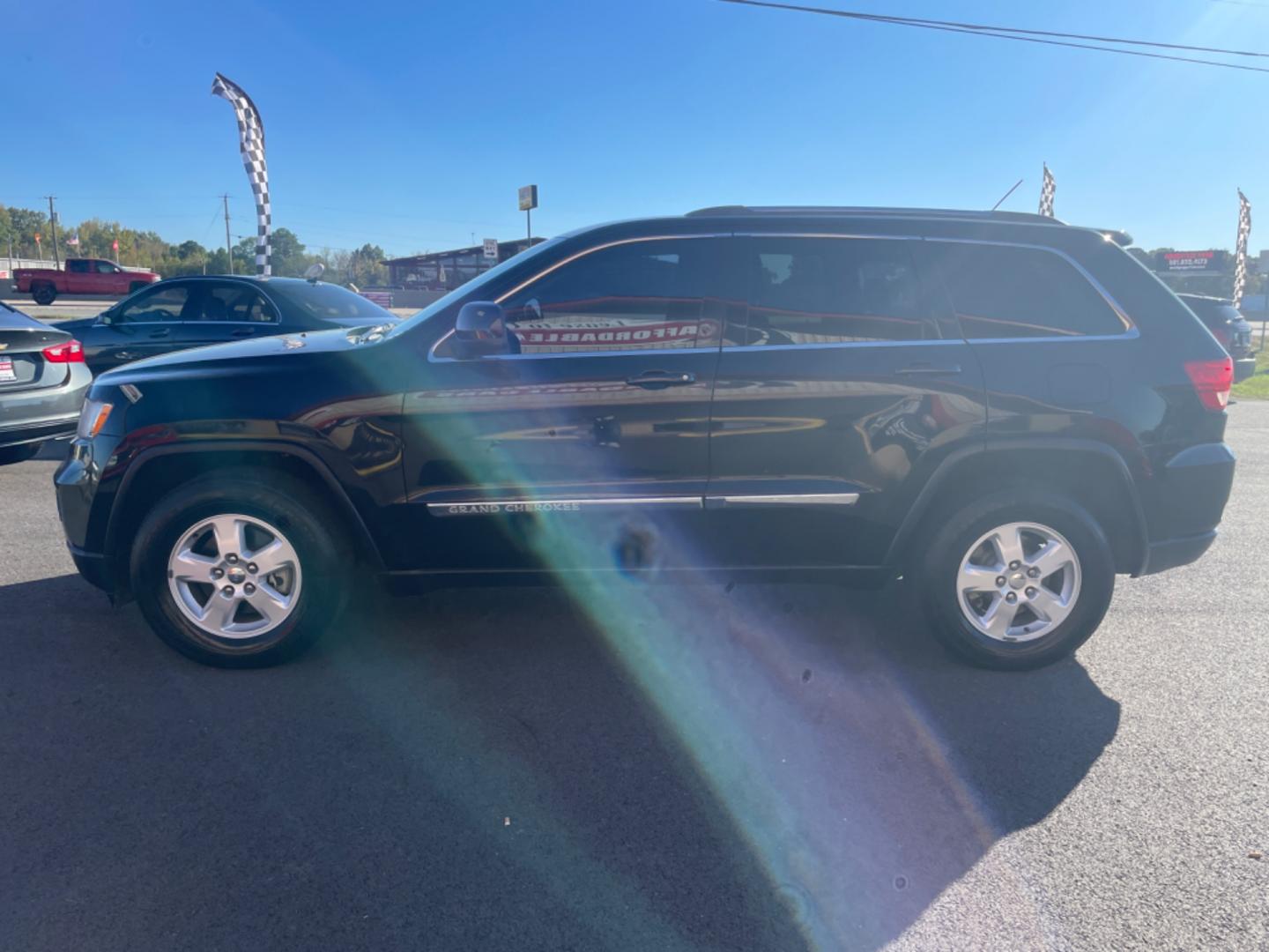 2012 Black Jeep Grand Cherokee (1C4RJFAG9CC) with an V6, Flex Fuel, 3.6 Liter engine, Automatic, 5-Spd transmission, located at 8008 Warden Rd, Sherwood, AR, 72120, (501) 801-6100, 34.830078, -92.186684 - Photo#4