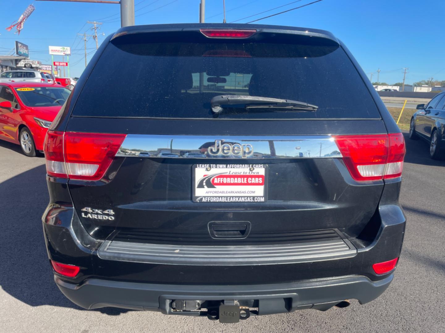 2012 Black Jeep Grand Cherokee (1C4RJFAG9CC) with an V6, Flex Fuel, 3.6 Liter engine, Automatic, 5-Spd transmission, located at 8008 Warden Rd, Sherwood, AR, 72120, (501) 801-6100, 34.830078, -92.186684 - Photo#6