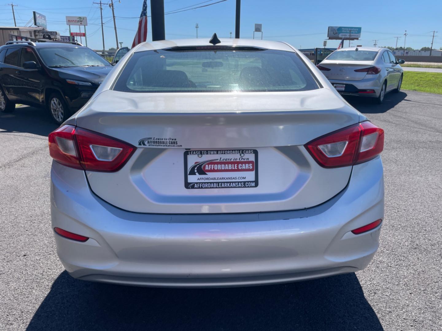 2018 Silver Chevrolet Cruze (1G1BC5SM7J7) with an 4-Cyl, Turbo, 1.4 Liter engine, Automatic, 6-Spd transmission, located at 8008 Warden Rd, Sherwood, AR, 72120, (501) 801-6100, 34.830078, -92.186684 - Photo#6