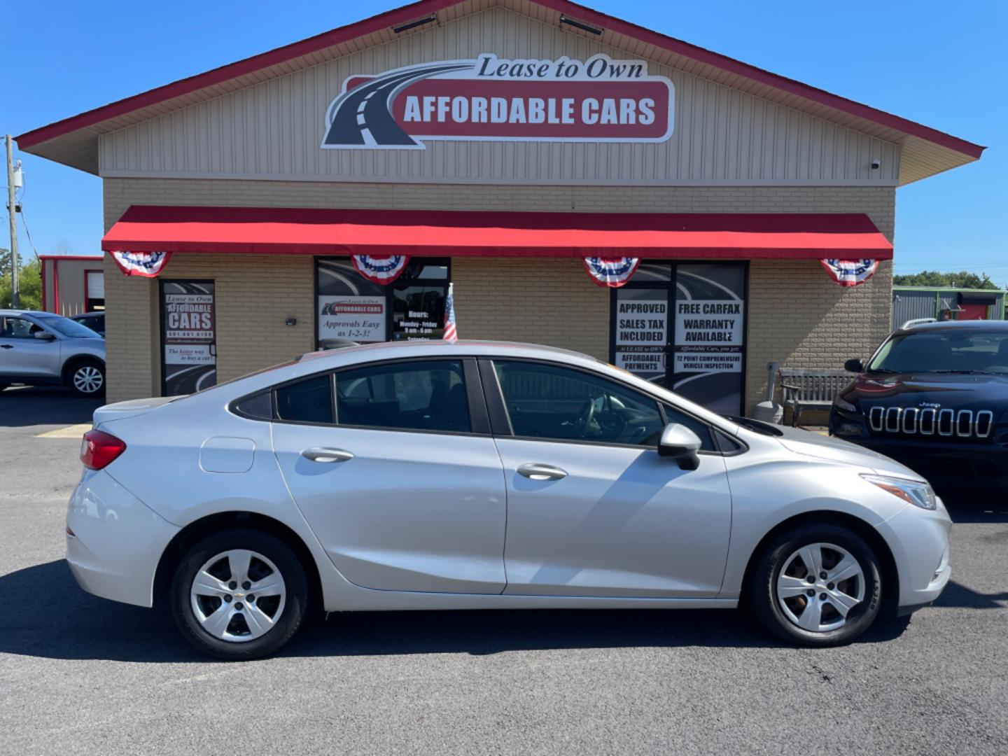 2018 Silver Chevrolet Cruze (1G1BC5SM7J7) with an 4-Cyl, Turbo, 1.4 Liter engine, Automatic, 6-Spd transmission, located at 8008 Warden Rd, Sherwood, AR, 72120, (501) 801-6100, 34.830078, -92.186684 - Photo#0