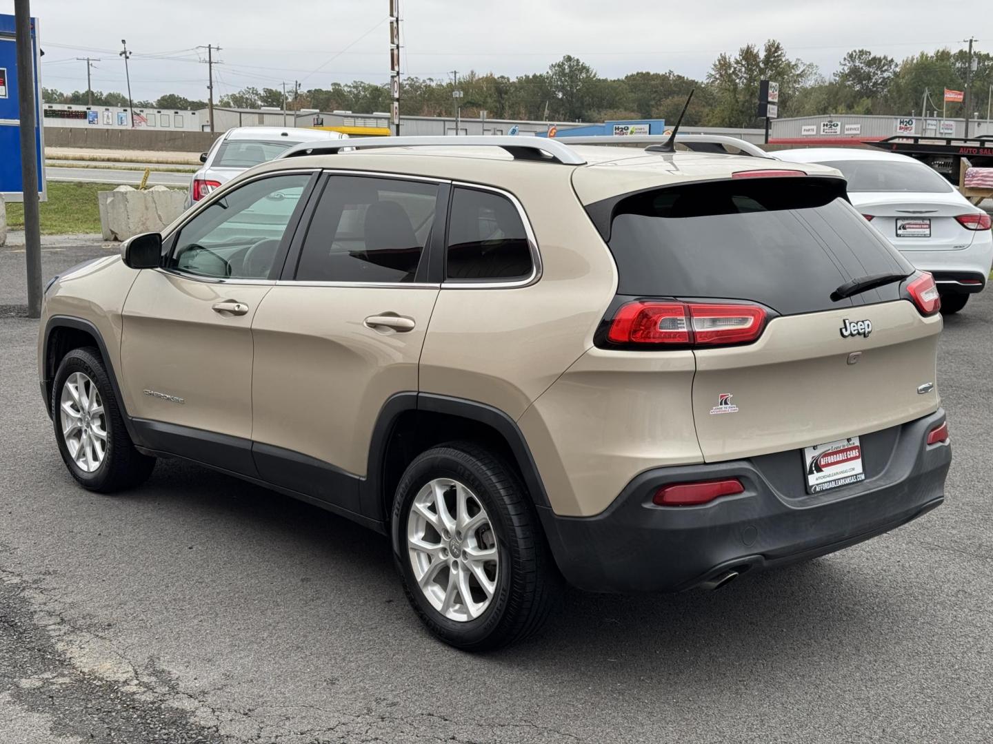 2014 Gold Jeep Cherokee (1C4PJLCB3EW) with an 4-Cyl, 2.4 Liter engine, Automatic, 9-Spd transmission, located at 8008 Warden Rd, Sherwood, AR, 72120, (501) 801-6100, 34.830078, -92.186684 - Photo#5