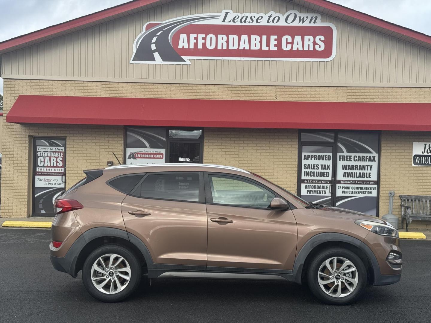 2016 Brown Hyundai Tucson (KM8J33A47GU) with an 4-Cyl, 2.0 Liter engine, Auto, 6-Spd Shiftronic transmission, located at 8008 Warden Rd, Sherwood, AR, 72120, (501) 801-6100, 34.830078, -92.186684 - Photo#0